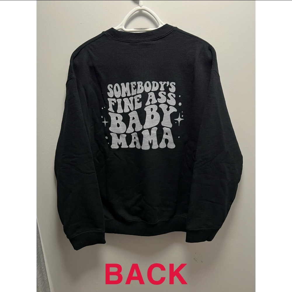Woman’s black crewneck